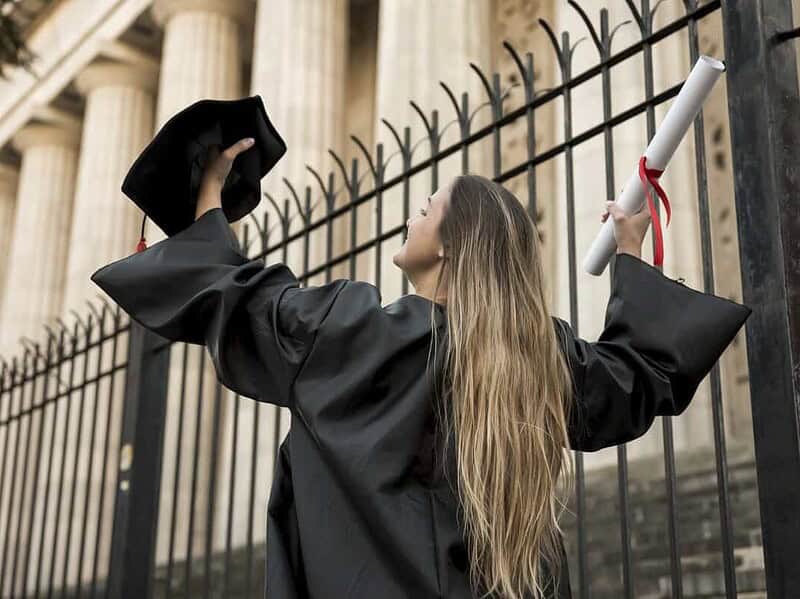 low angle young woman academic dress